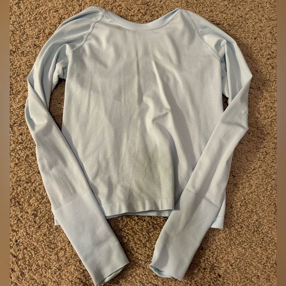 light blue, long sleeve swiftly, tech size 4 worn once can negotiate price
